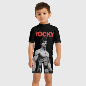 Детский купальный костюм 3D с принтом ROCKY в городе Новоалтайск, Полиэстер 85%, Спандекс 15% | застежка на молнии на спине | creed | jordan | lundgren | mix fight | mixfight | stallone | ufc | бальбоа | бокс | джордан | крид | лундгрен | мышцы | ринг | роки | рокки | сильвестр | сталлоне | сталоне